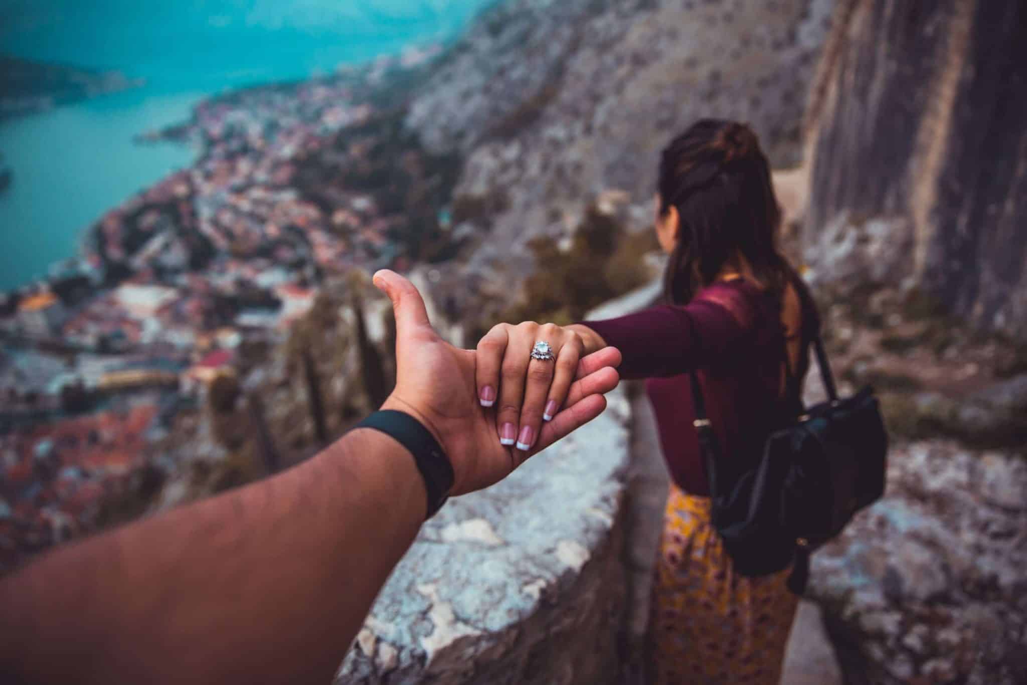 Photo of woman holding out hand in Rio de Janeiro by Christopher Alvarenga for Unsplash