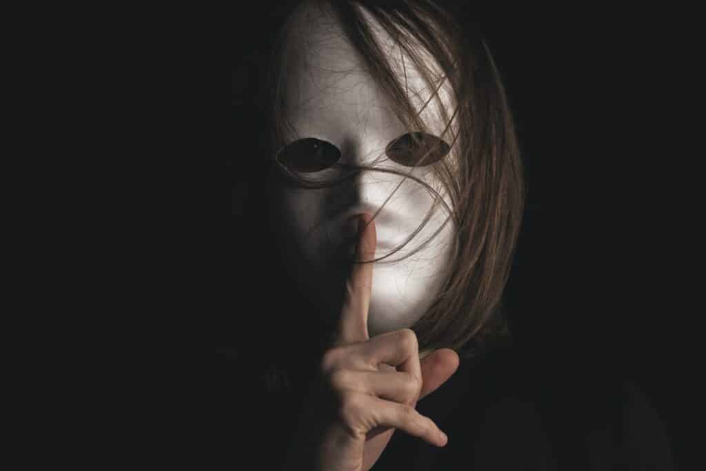 Photo of masked face with silence finger by by Engin Akyurt on Unsplash
