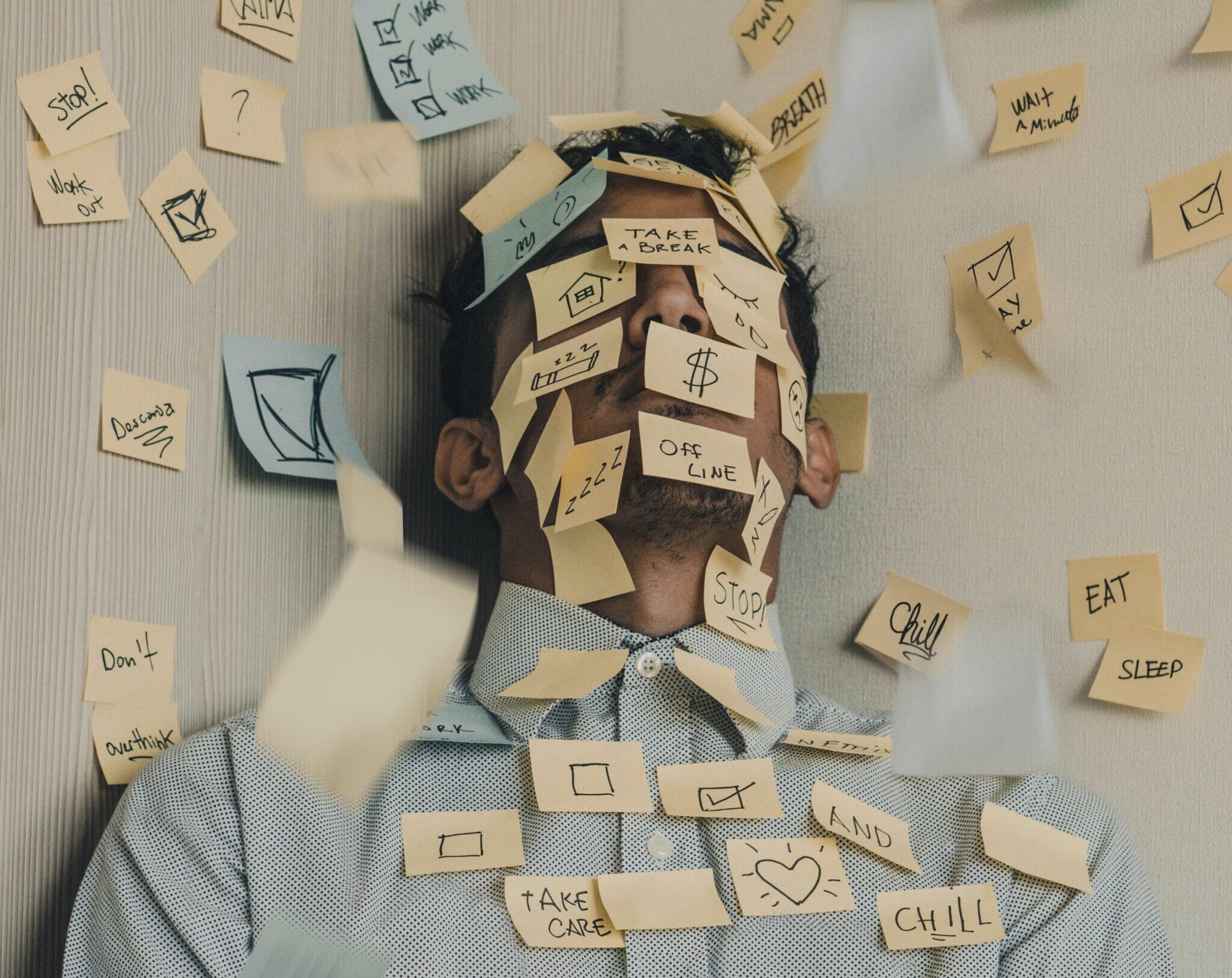 Photo of Man covered with sticky notes by Luis Villasmil for Unsplash