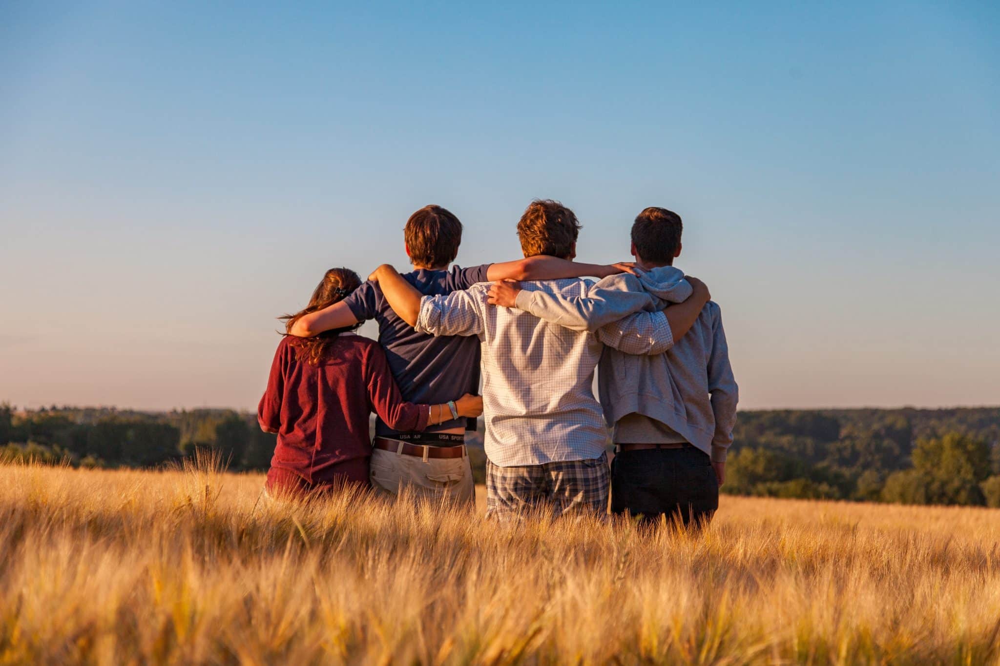 Group of friends embracing by Dim Hou for Unsplash